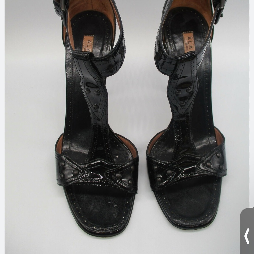 Alaia patent leather studded T strap heel